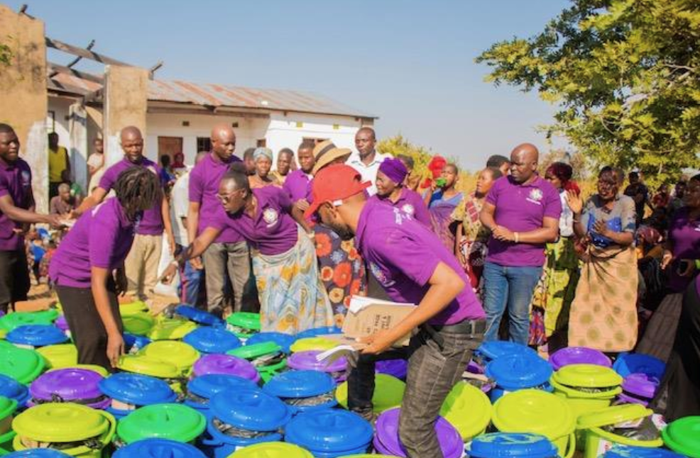 Community health camp volunteers handing out supplies